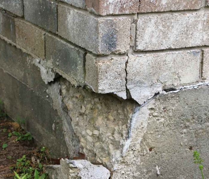 Visible foundation damage signs including wall cracks, uneven floors, and structural settlement in a residential property
